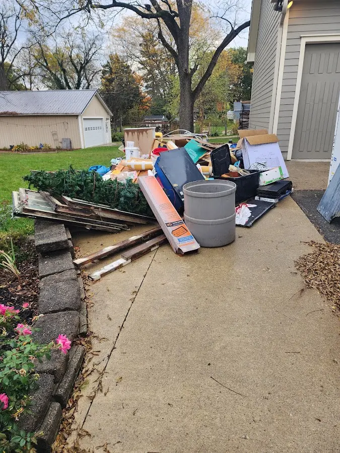 Dumpster being loaded with debris for Demolition Dumpster Rental in Amherst